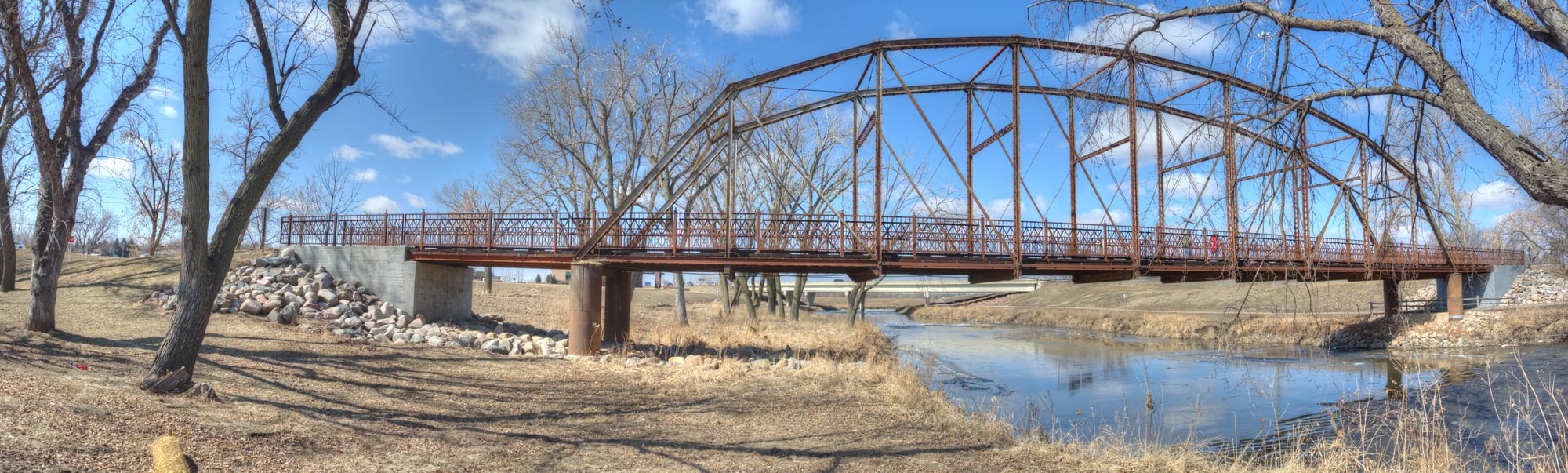 A former railroad bridge crosses the Big Sioux River in southern Sioux Falls, now used as a pathway.